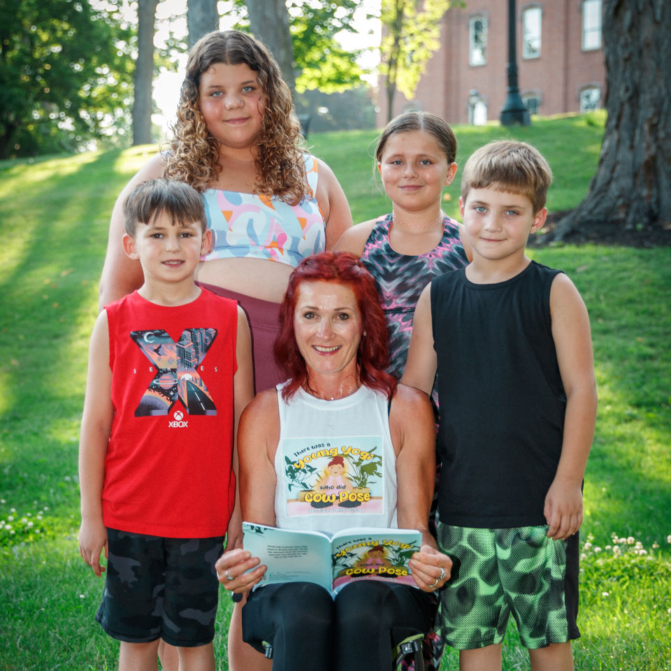 Jessica reading her book with children